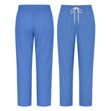 Uk Scrub Supply Blue scrub pants shown from the front and back, featuring an elastic waistband, white drawstring, and side pockets on a plain white background.