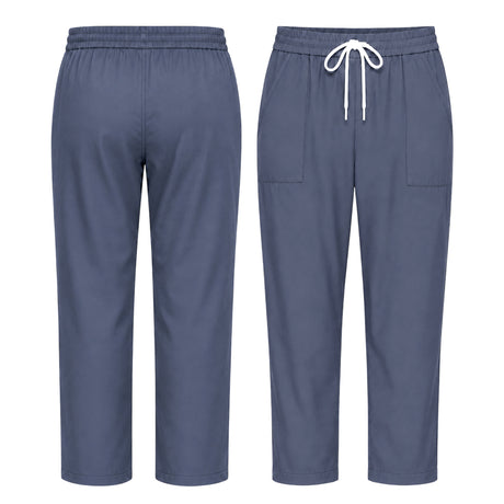 Uk Scrub Supply A pair of scrub pants shown from the front and back, in a slate blue color. The front view shows a white drawstring at the elastic waistband and two front patch pockets.