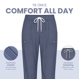 Uk Scrub Supply pair of slate blue scrub pants with a white drawstring, shown on a light gray background with marketing text and circular detail callouts highlighting breathable comfort and adjustable drawstring features.