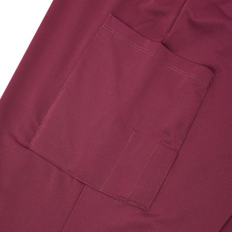Close-up of a maroon fabric pocket.