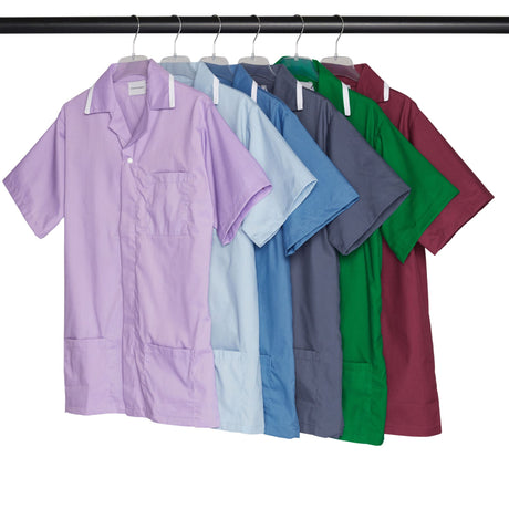 Row of multicolored short-sleeve shirts on hangers hanging on a black rod.