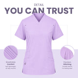 A lavender purple V-neck scrub top shown on a light background with marketing text reading 'DETAIL YOU CAN TRUST' and two circular inset detail callouts highlighting breathable comfort and precision stitching.