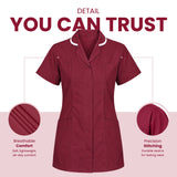 A burgundy short-sleeve scrub top shown on a white and pale pink graphic background with marketing text reading 'DETAIL YOU CAN TRUST' and two circular detail callouts highlighting breathability and stitching. Women’s Medical Tunic Nursing & Healthcare Uniform UK scrub tops
scrubs clothing
nursing scrubs
medical uniforms
scrubs for sale
work scrubs
buy medical uniforms
female scrub tops
order scrubs
scrubs to purchase
cheap scrub tops
cotton scrubs uk
scrubs top
clothing scrubs
dental workwear
for sale scru