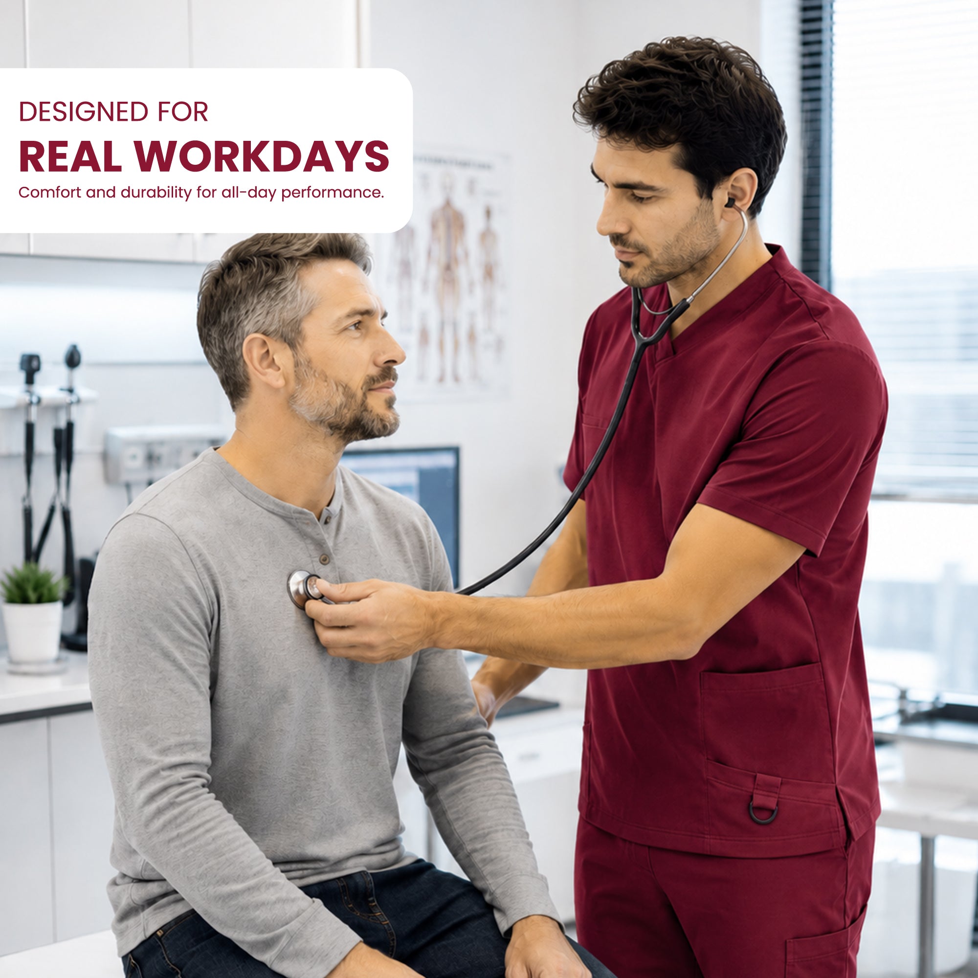 A man in maroon medical scrubs uses a stethoscope on a seated patient in a bright clinic. A white text box in the top left reads 'DESIGNED FOR REAL WORKDAYS' with smaller text below.
